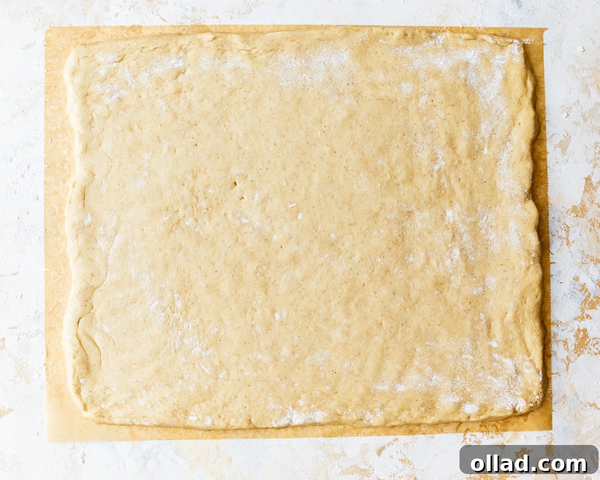 Irresistible Gluten-Free Cinnamon Rolls 13 dough rolled out into a rectangle.