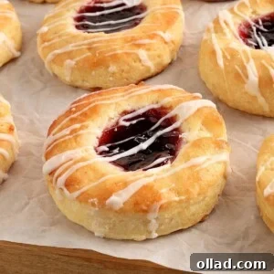 gluten-free Danish topped with jam on on white parchment paper