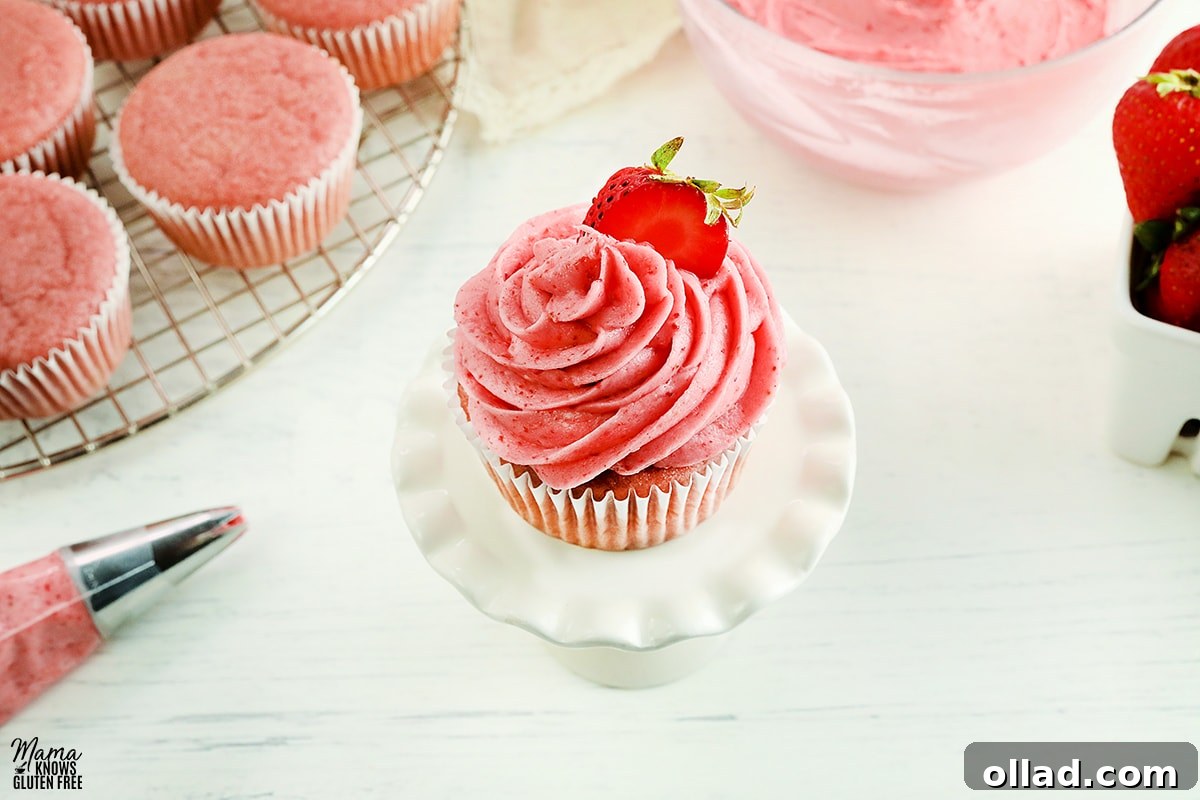 Delicious strawberry frosting on strawberry cupcakes, ready to be served