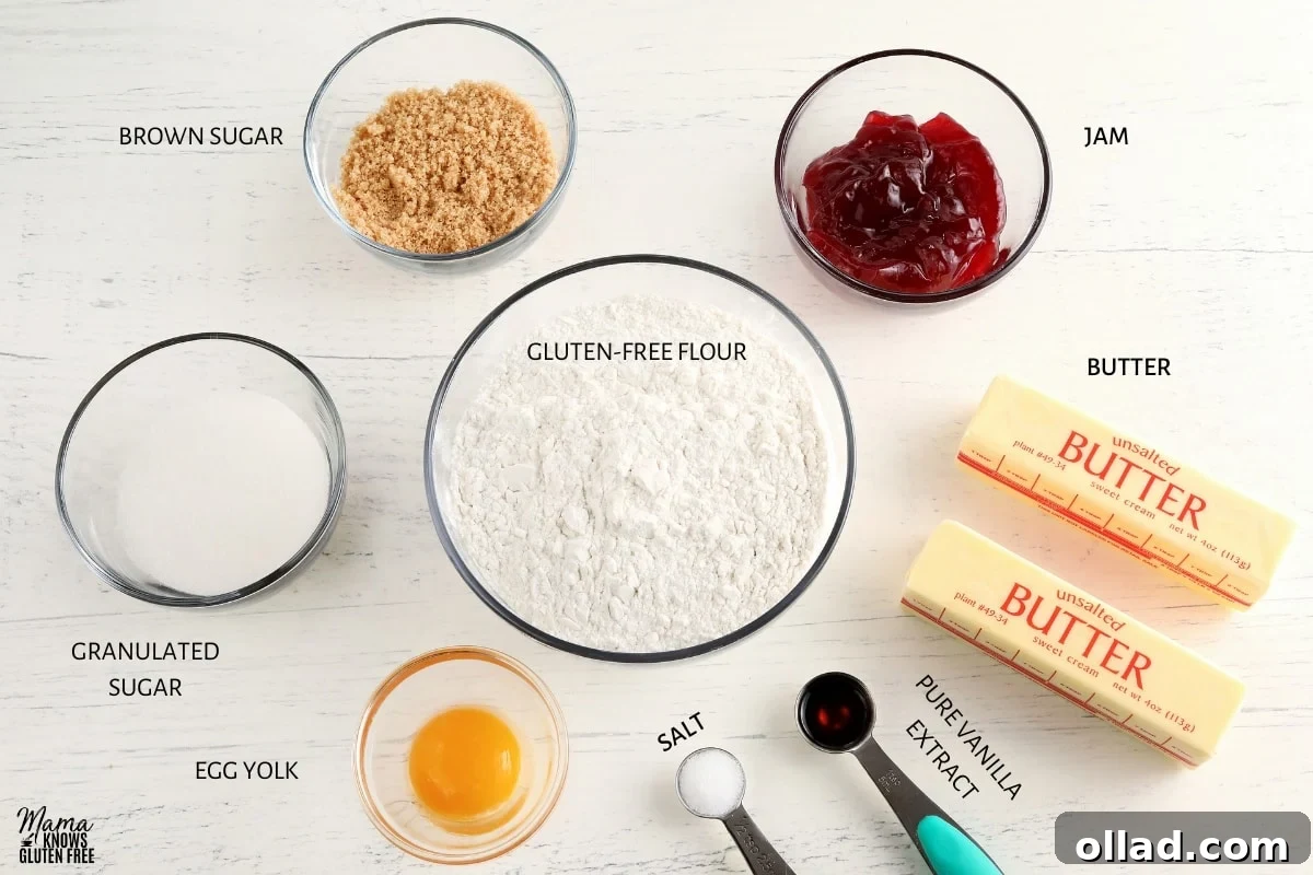 All the ingredients for gluten-free thumbprint cookies laid out on a clean surface, ready for preparation.