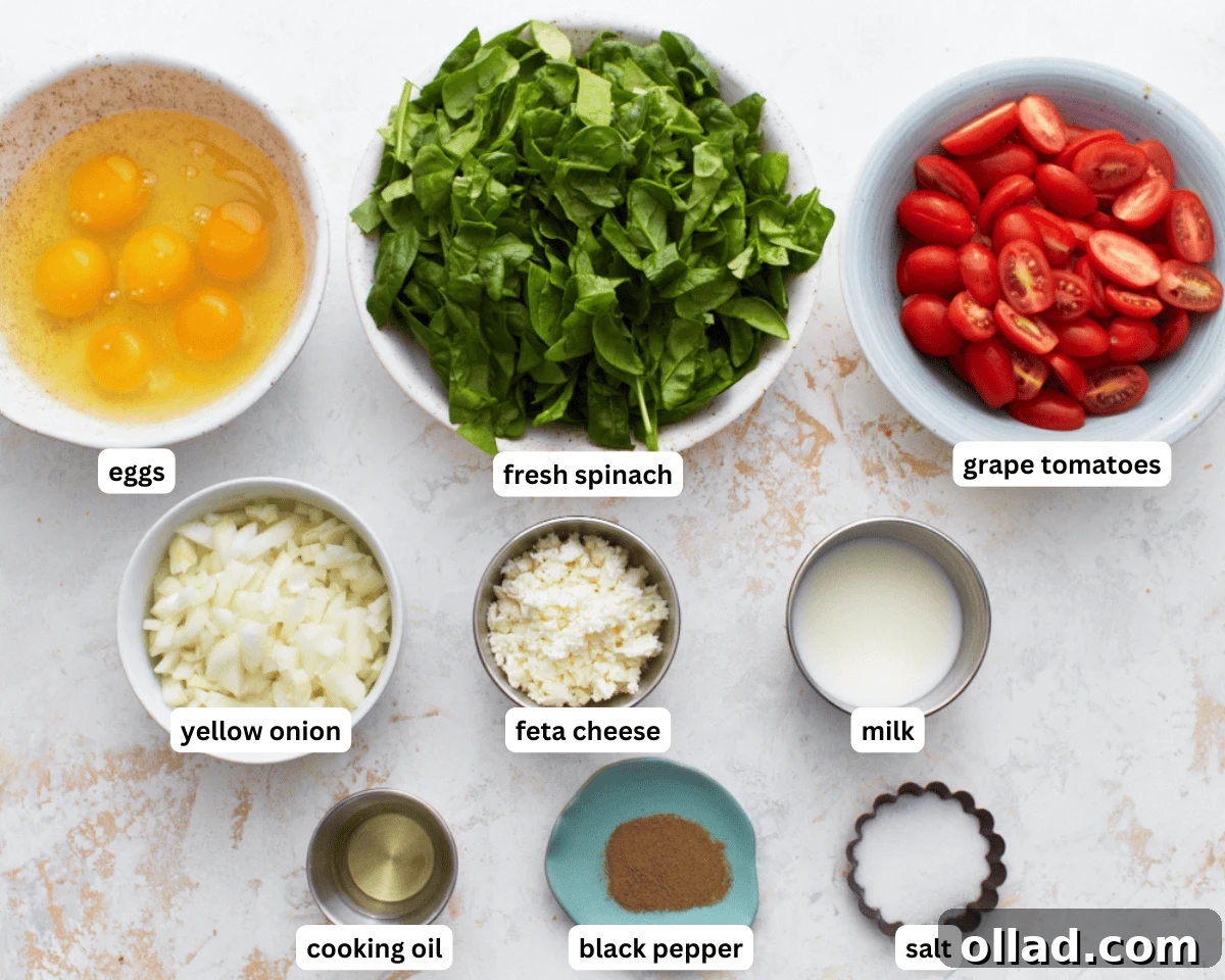A collection of fresh ingredients laid out to make a gluten-free frittata egg casserole, including eggs, vegetables, and cheese.