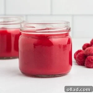 Raspberry coulis in a jar