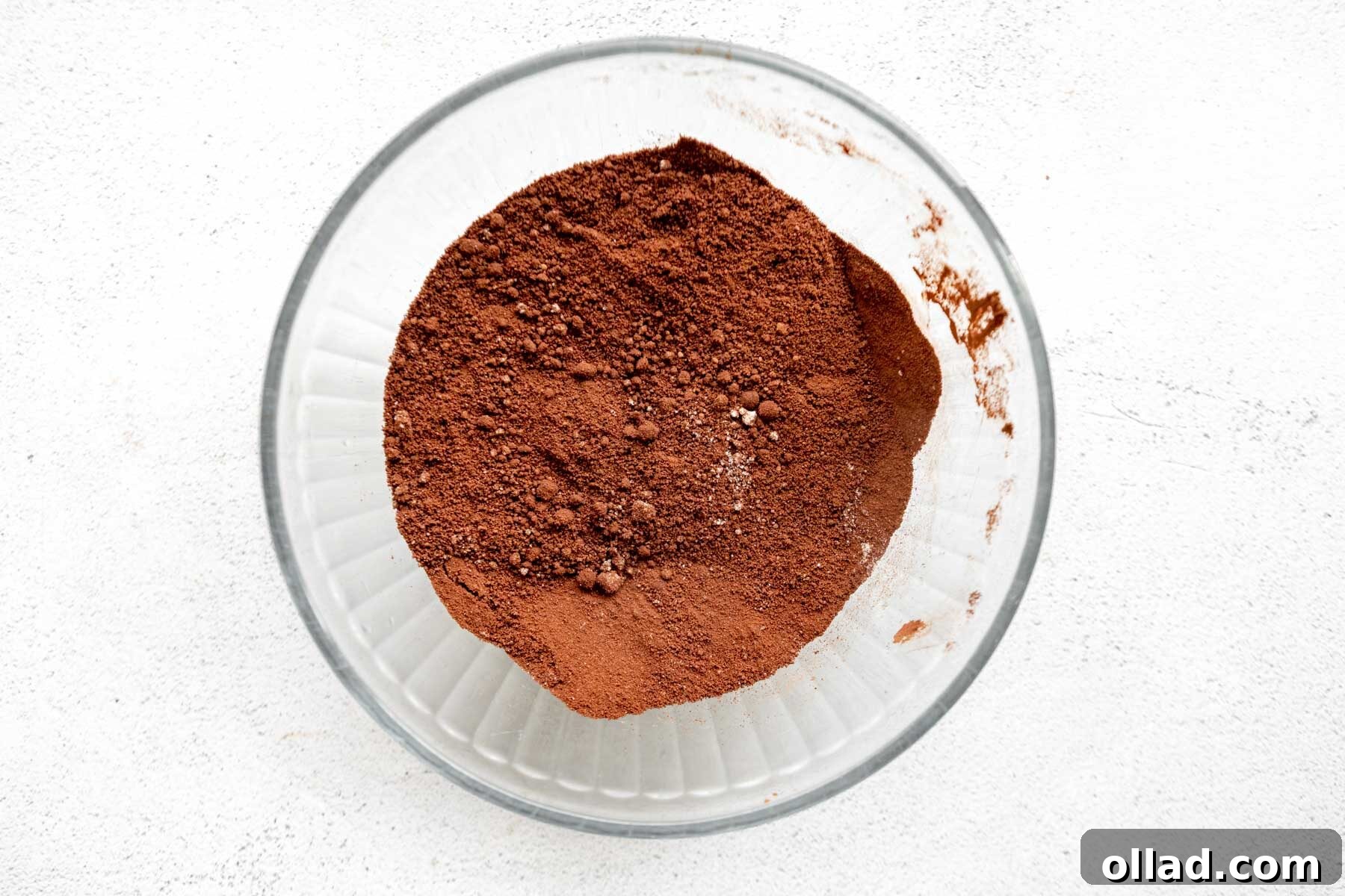 Decadent Almond Flour Fudge Brownies 5 Dry ingredients for almond flour brownies in a glass mixing bowl