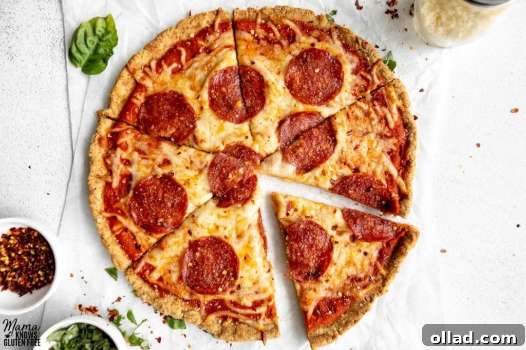 Sliced pepperoni pizza made using almond flour pizza crust, showcasing its crispy texture.