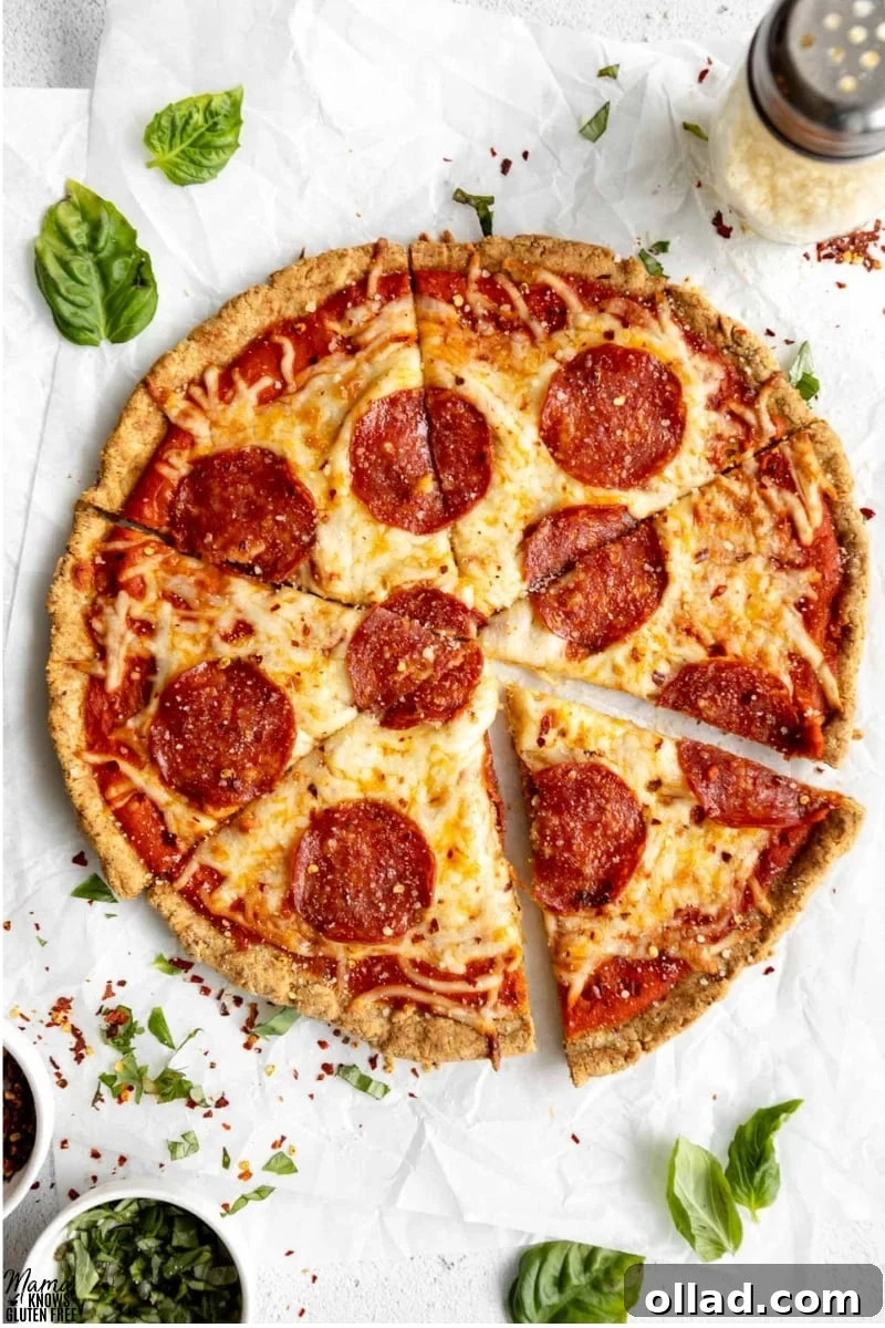 Pepperoni pizza baked using a Gluten-Free Almond Flour Pizza Crust, sliced and ready to serve.