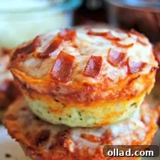 A top-down view of freshly baked gluten-free pizza bites, showcasing their deep dish crust, melted cheese, and delicious toppings.