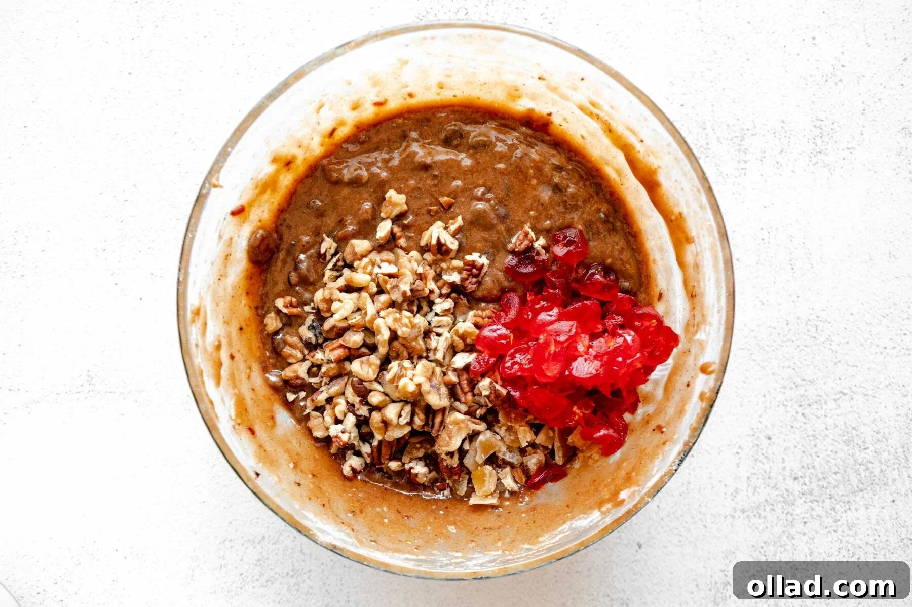 Deliciously Flourless Fruitcake 10 Gluten-free fruit cake batter with candied cherries, walnuts, pecans, and crystallized ginger folded in.