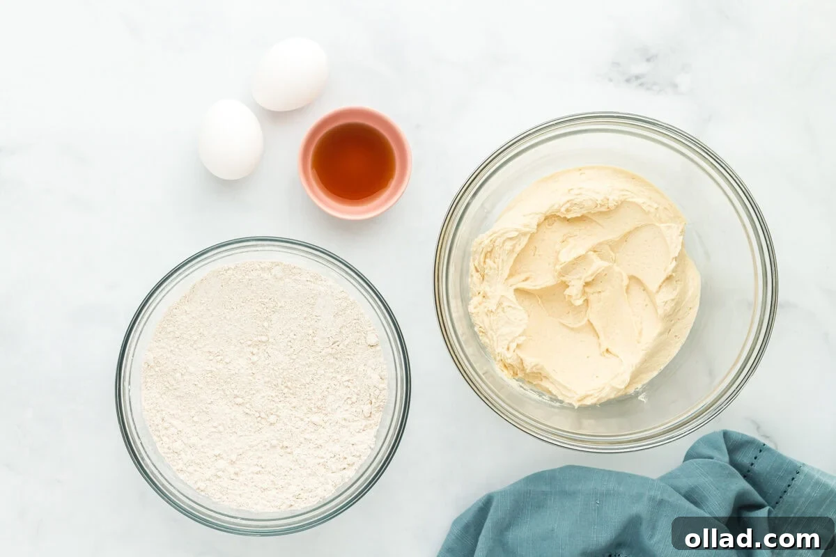 Dry ingredients (oat flour, cornstarch, baking soda, baking powder, salt) and wet ingredients (butter, sugars) for oat flour chocolate chip cookies in separate bowls.