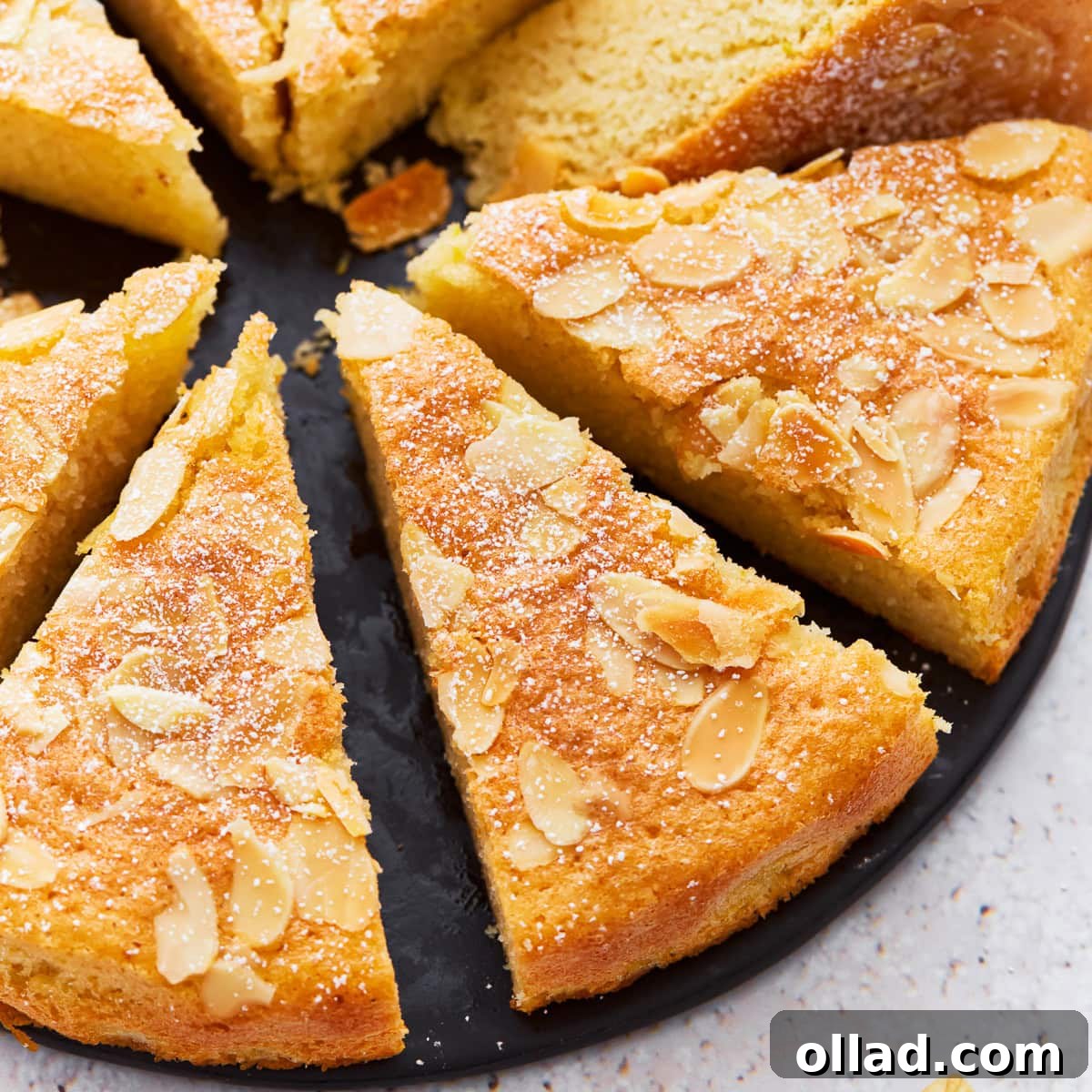 Irresistible Gluten-Free Cake Secrets 17 A close up of almond flour cake cut into slices.