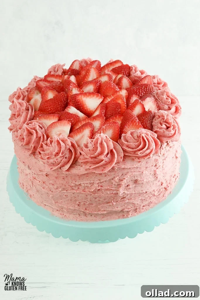 Irresistible Gluten-Free Cake Secrets 4 gluten-free strawberry cake on a blue cake stand with a white background