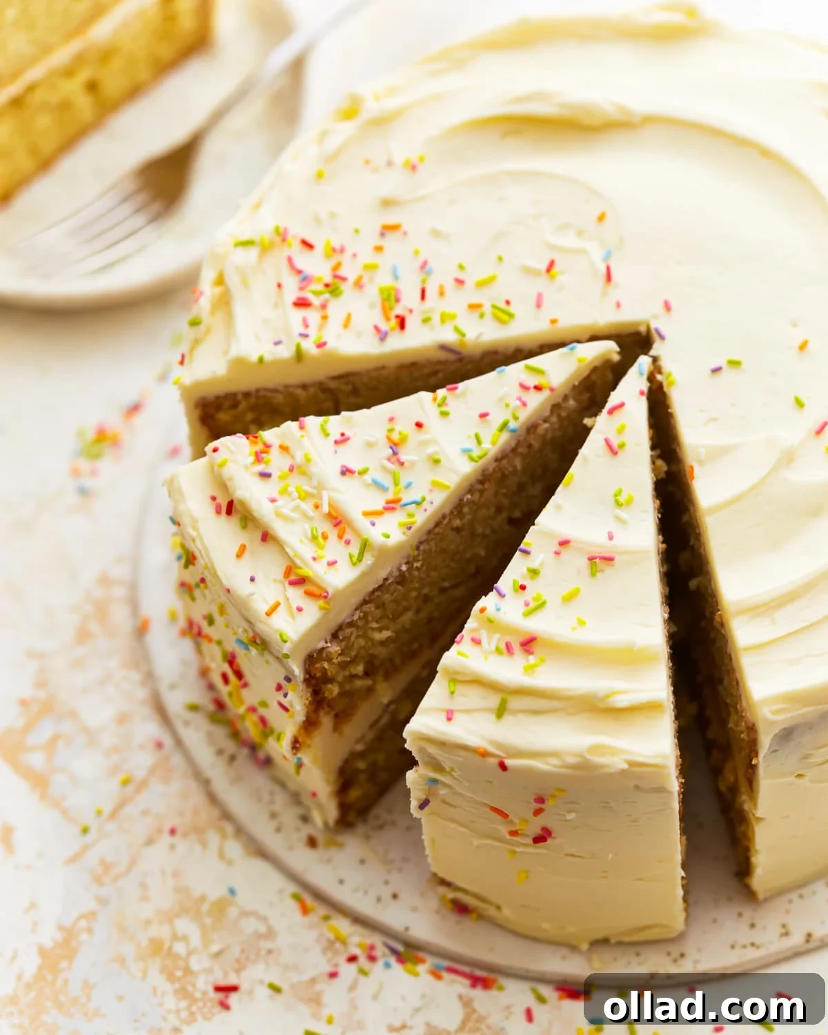 Irresistible Gluten-Free Cake Secrets 5 partially sliced gluten-free vanilla cake.