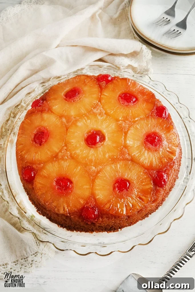 Irresistible Gluten-Free Cake Secrets 9 gluten-free pineapple upside down cake on a cake plate with plates and cake cutter in the background