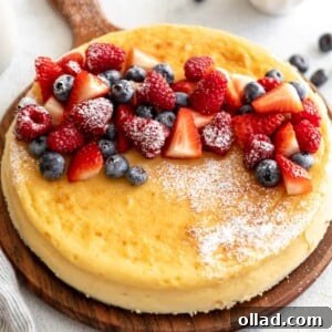 crustless cheesecake on cutting board with fruit