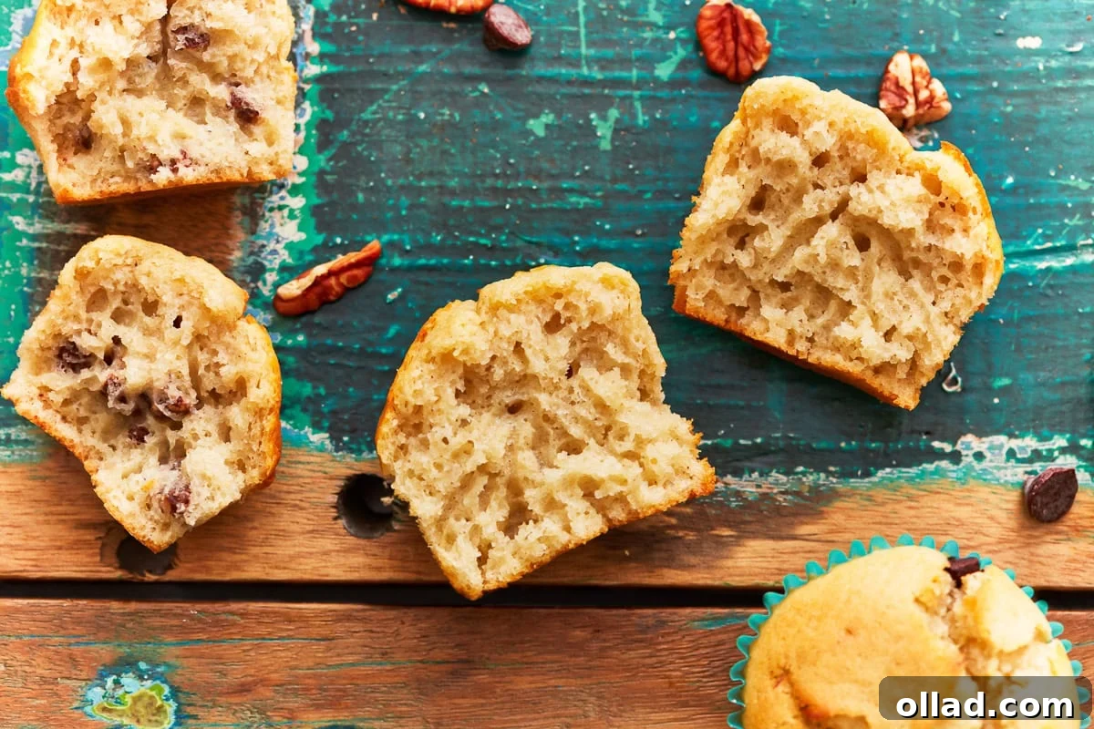 Irresistible Gluten-Free Muffins 8 A close-up of a perfectly baked gluten-free muffin, sliced in half to reveal its tender, moist, and airy interior crumb, demonstrating its delightful texture.
