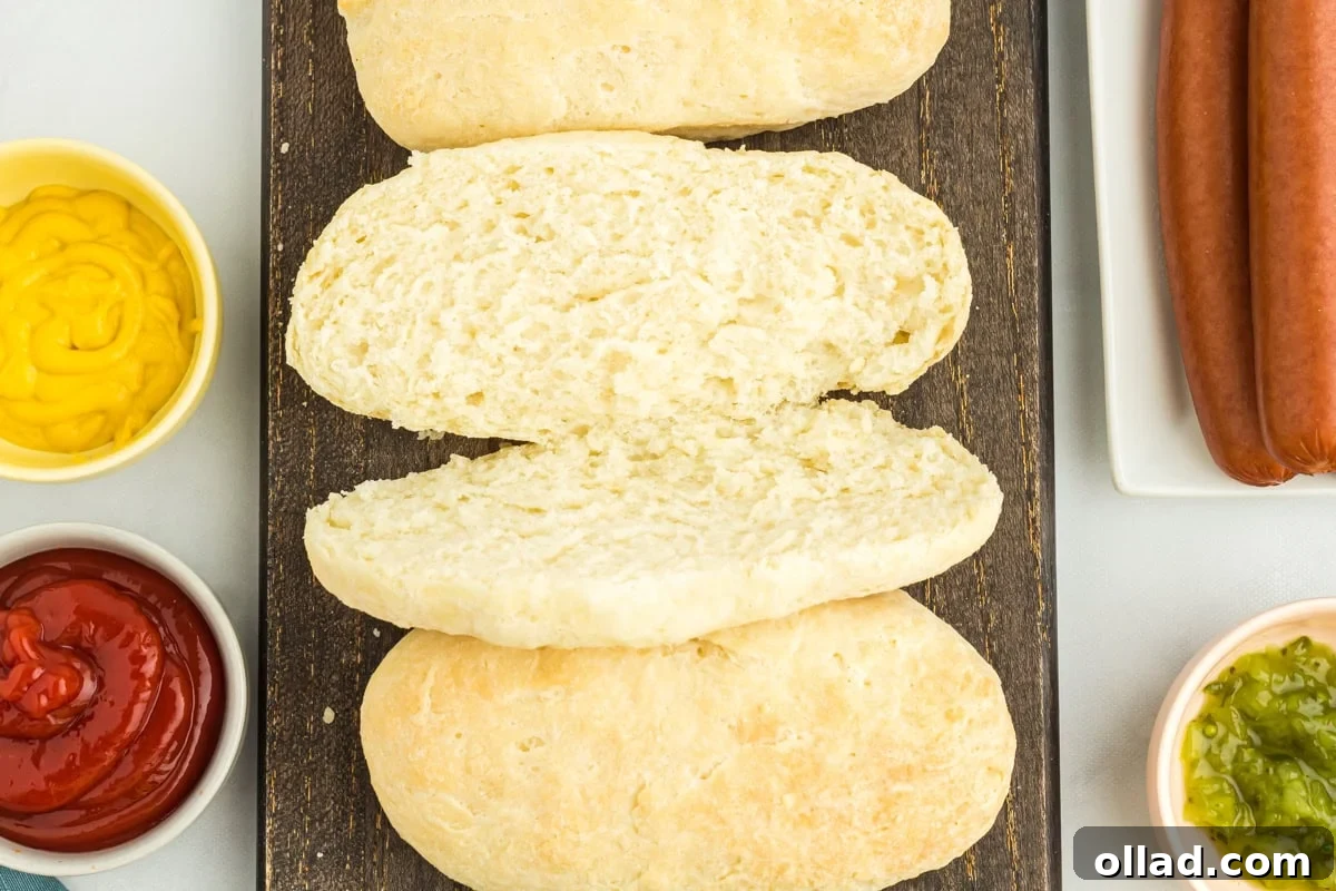 overhead view of a perfectly sliced gluten-free hot dog bun, ready for filling.