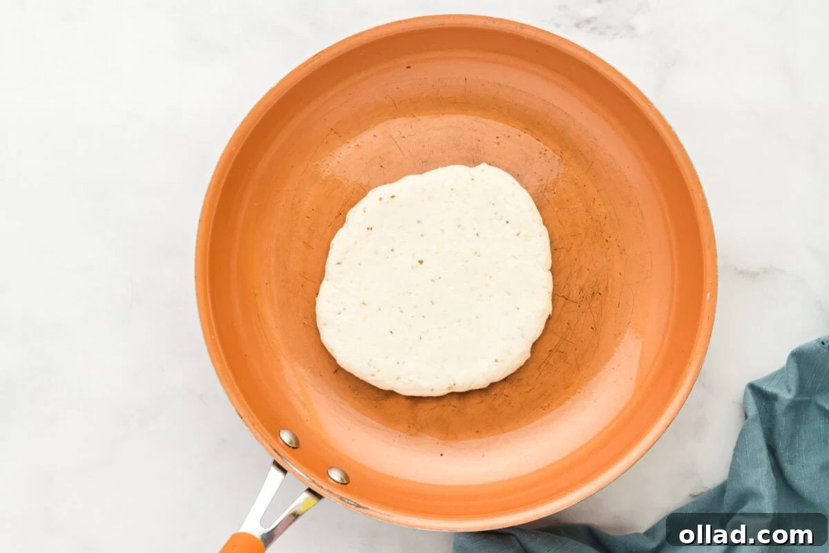 Pillowy Gluten-Free Flatbread 8 gluten-free flatbread dough in an orange skillet