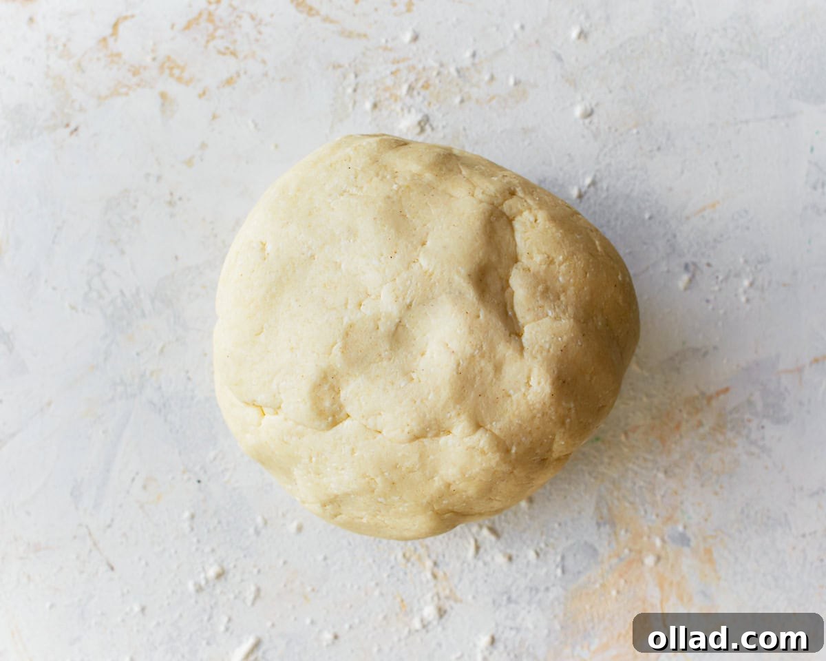 Pandebono bread dough transferred from the food processor to a clean surface lightly dusted with tapioca flour.