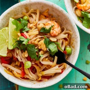 Gluten-free pad thai in a bowl with a fork