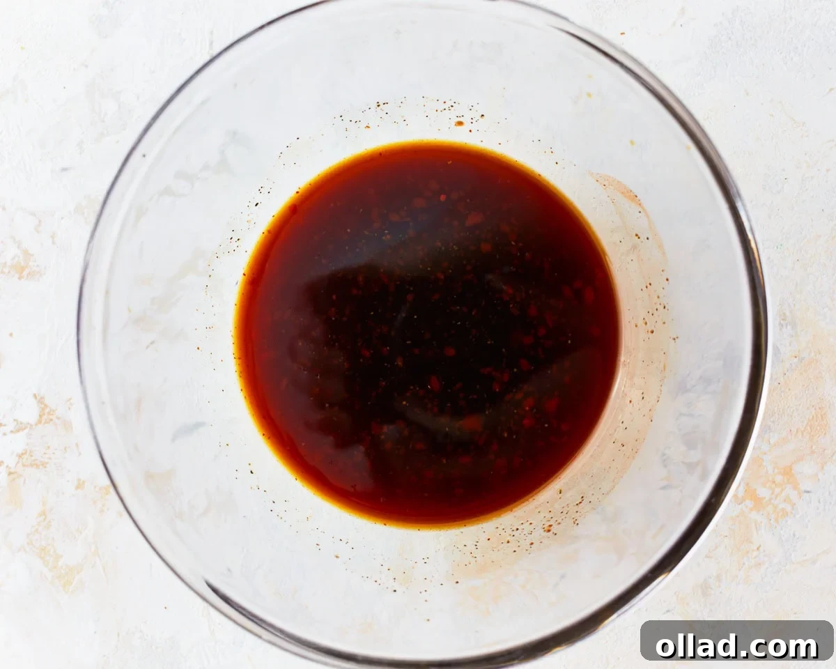 Pad thai sauce in a glass mixing bowl