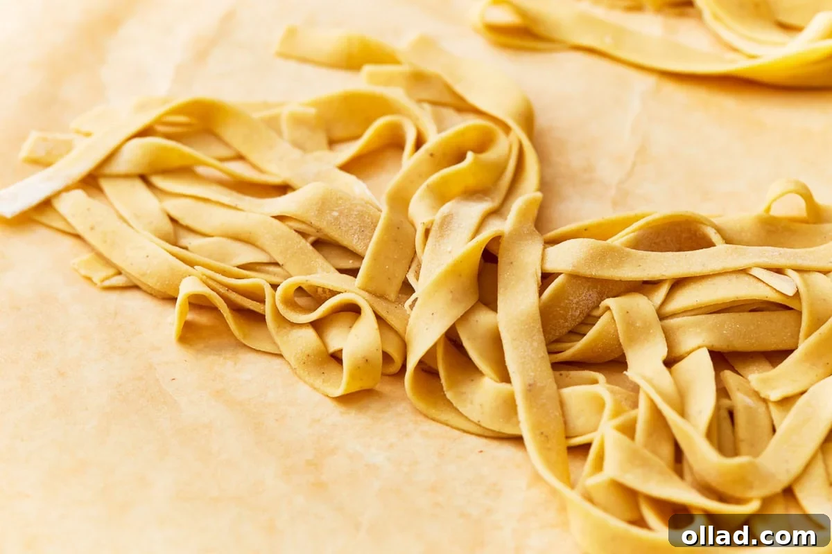 A generous serving of freshly cooked gluten-free egg noodles ready to be tossed with your favorite sauce or added to a hearty soup.