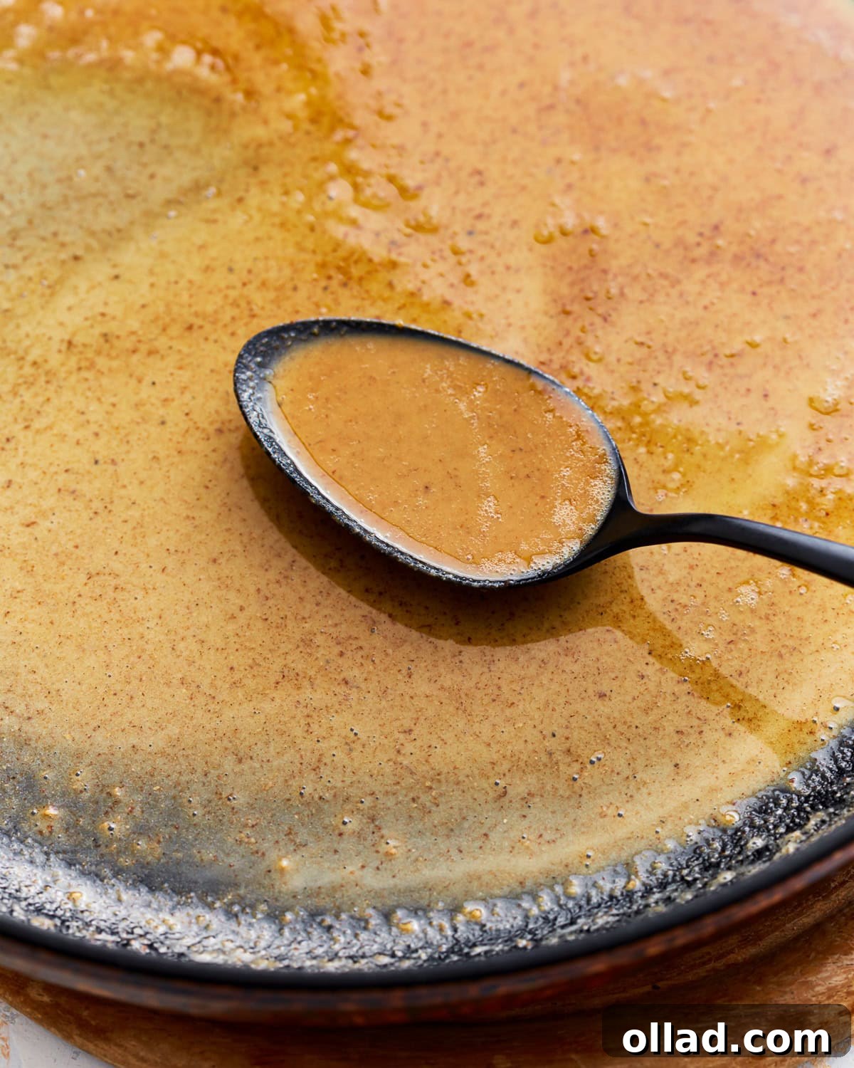 Gluten-free roux in a skillet with a spoon.