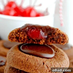 Gluten-Free Chocolate Cherry Thumbprint Cookies, featuring a rich chocolate cookie base with a vibrant cherry filling and a chocolate drizzle.