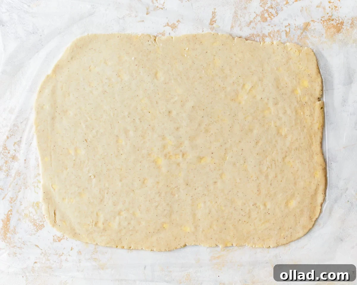 Unbelievably Flaky Gluten-Free Puff Pastry 10 Chilled gluten-free puff pastry dough rolled out into a large rectangle on a floured surface.