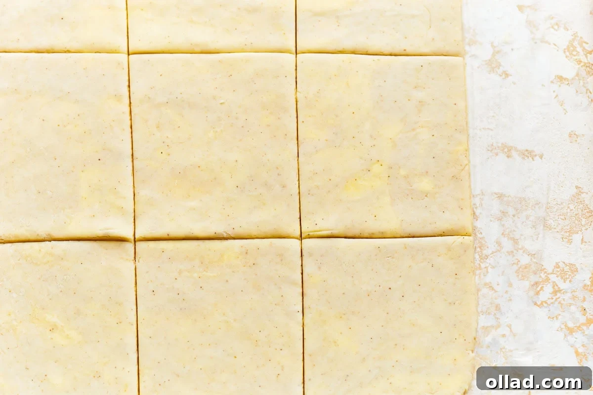 Unbelievably Flaky Gluten-Free Puff Pastry 18 A close-up view of the prepared gluten-free puff pastry dough, cut into squares, ready for baking or storage.