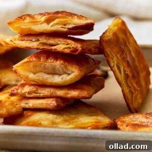 Unbelievably Flaky Gluten-Free Puff Pastry 3 Side view of gluten-free puff pastry squares stacked on top of each other.