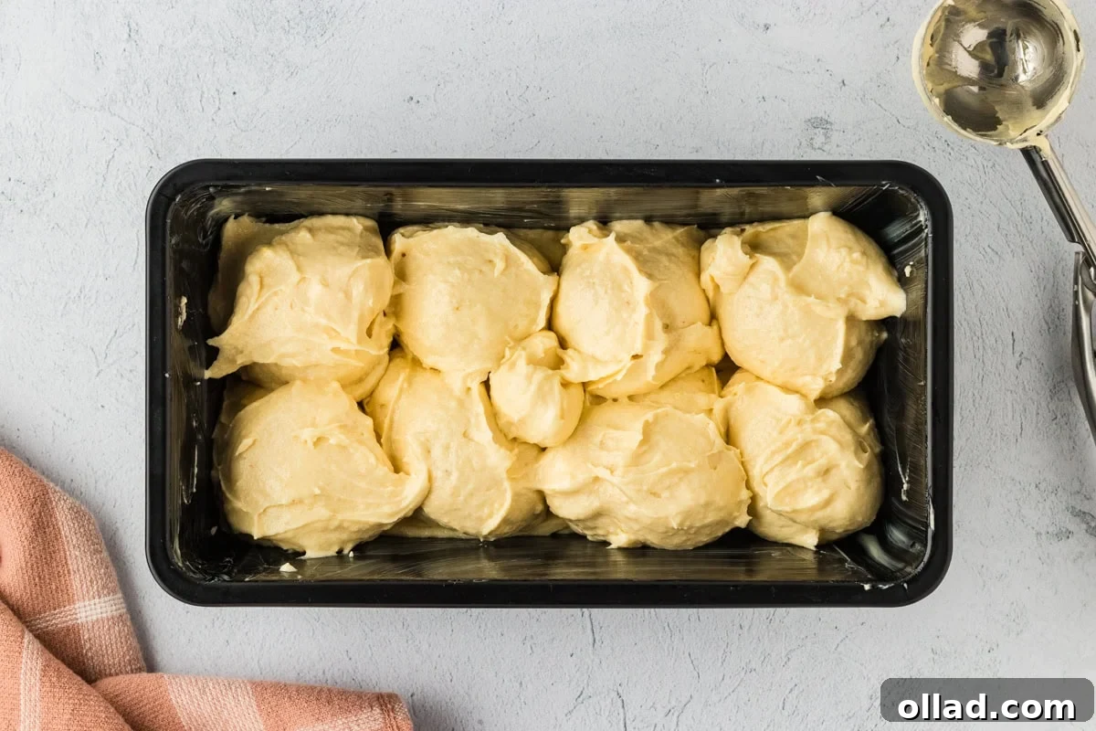 Fluffy Gluten-Free Brioche 13 Dollops of gluten-free brioche batter in a loaf pan.