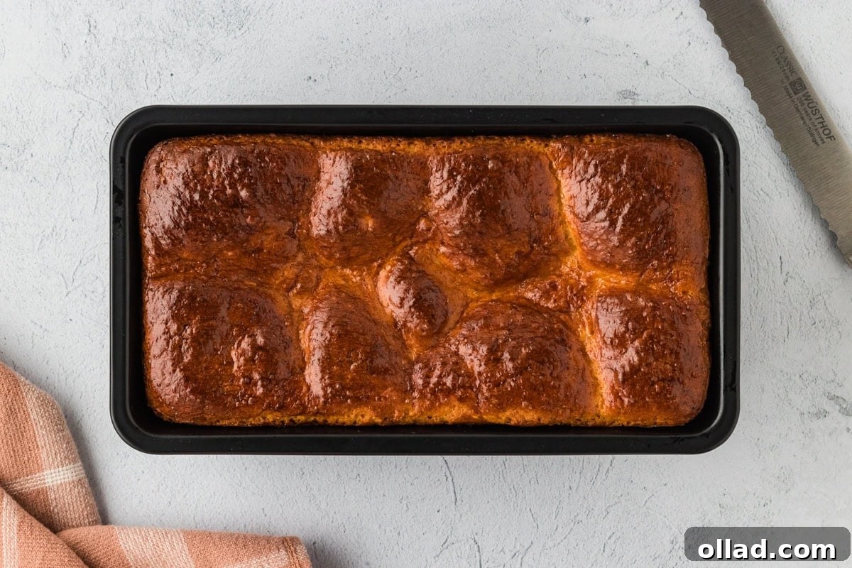 Fluffy Gluten-Free Brioche 16 Freshly baked gluten-free brioche bread in a loaf pan.