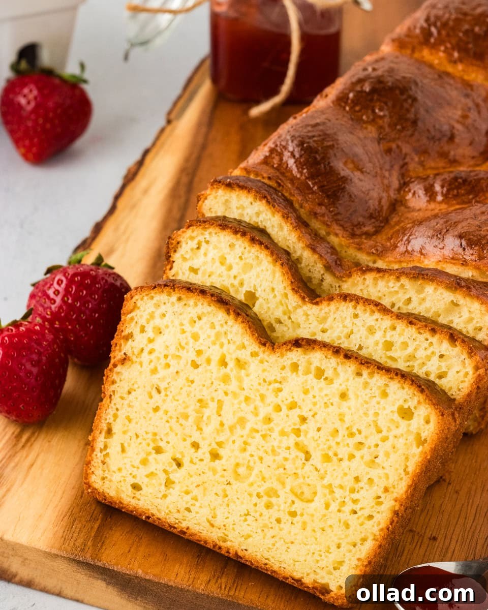 Fluffy Gluten-Free Brioche 5 Slices of gluten-free brioche bread on a wooden chopping board.