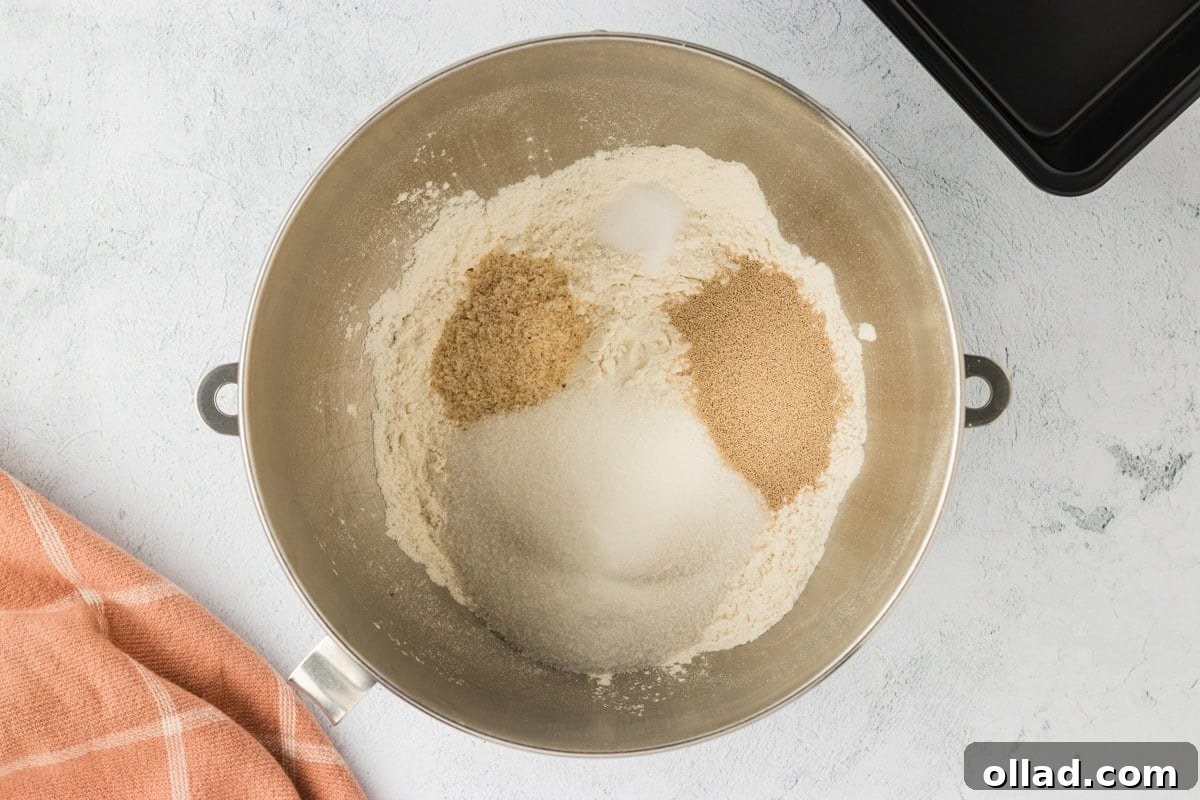 Fluffy Gluten-Free Brioche 7 Gluten-free flour, sugar, psyllium husk, and instant yeast in a mixing bowl.