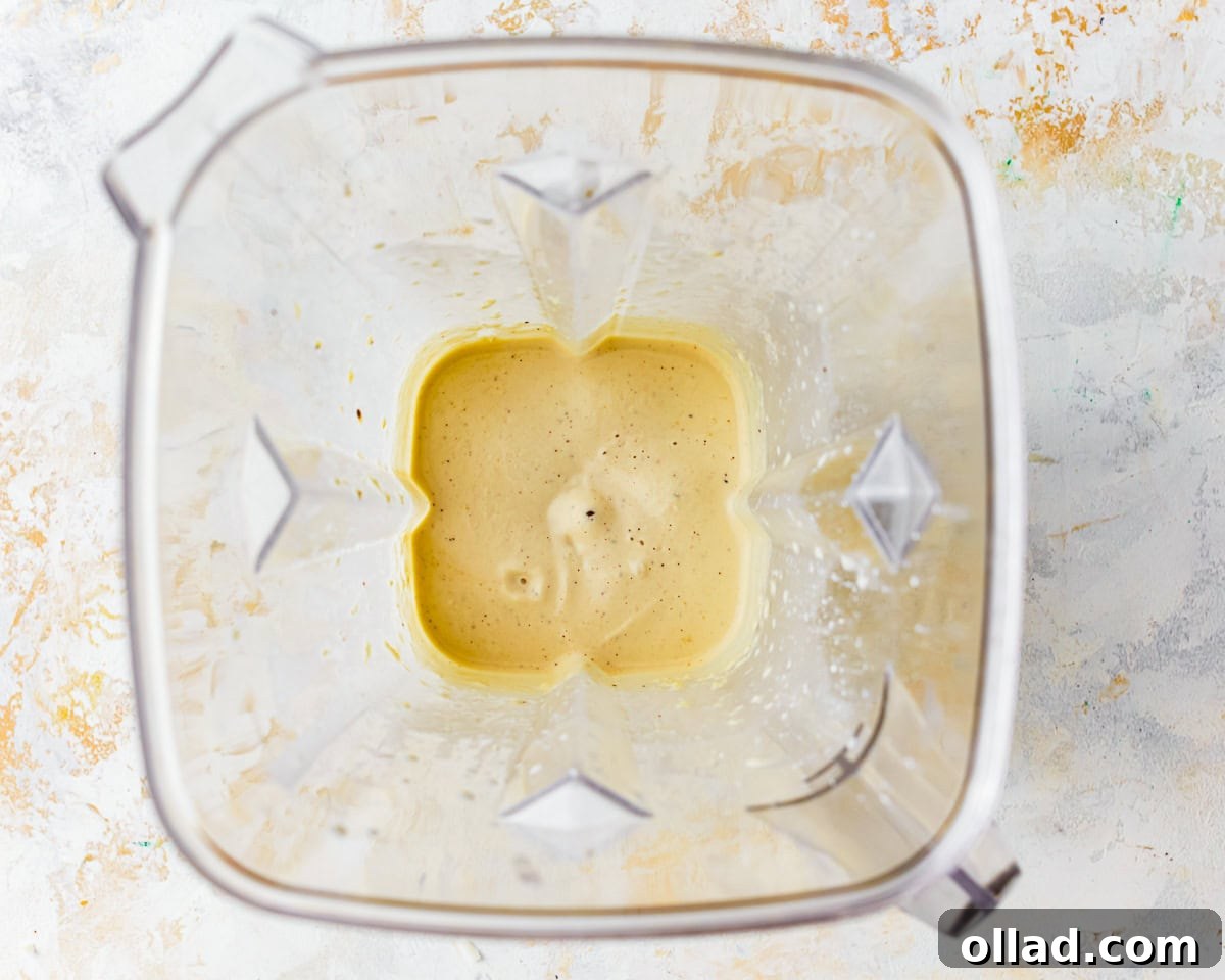 Dairy-free cheesy sauce in a blender.