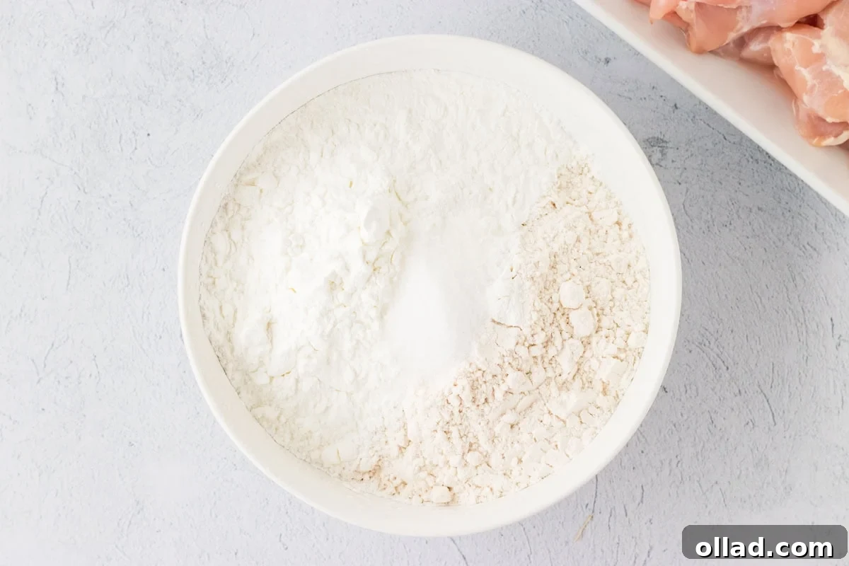 Irresistible Gluten-Free Sweet and Sour Chicken 10 flour, cornstarch mixture in white bowl