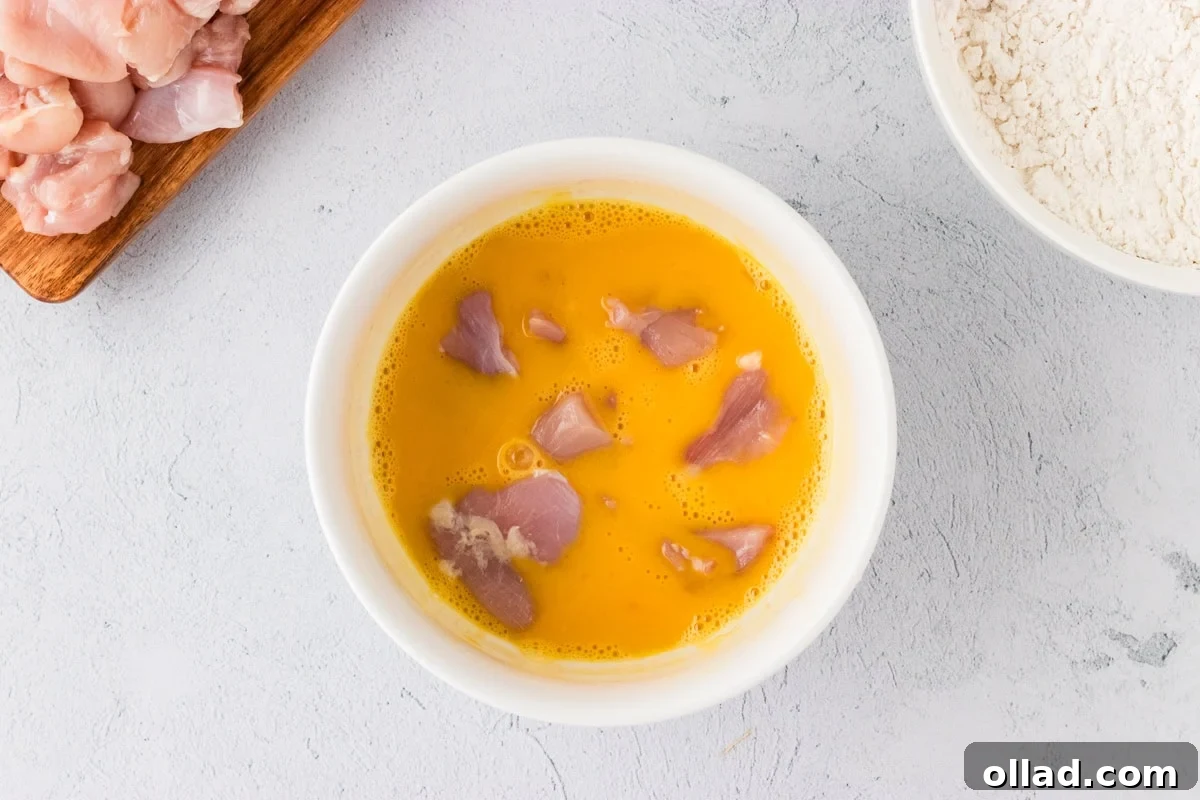Irresistible Gluten-Free Sweet and Sour Chicken 11 raw chicken pieces in egg wash