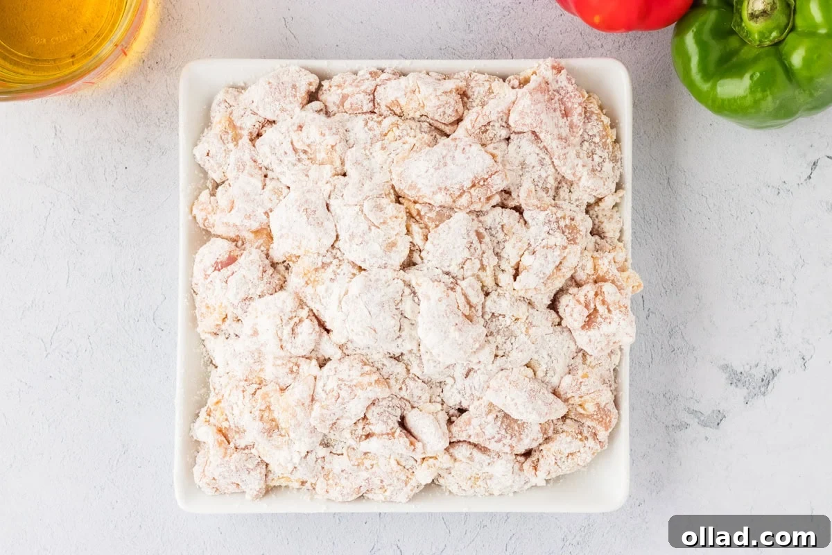 Irresistible Gluten-Free Sweet and Sour Chicken 13 flour coated chicken in white square bowl
