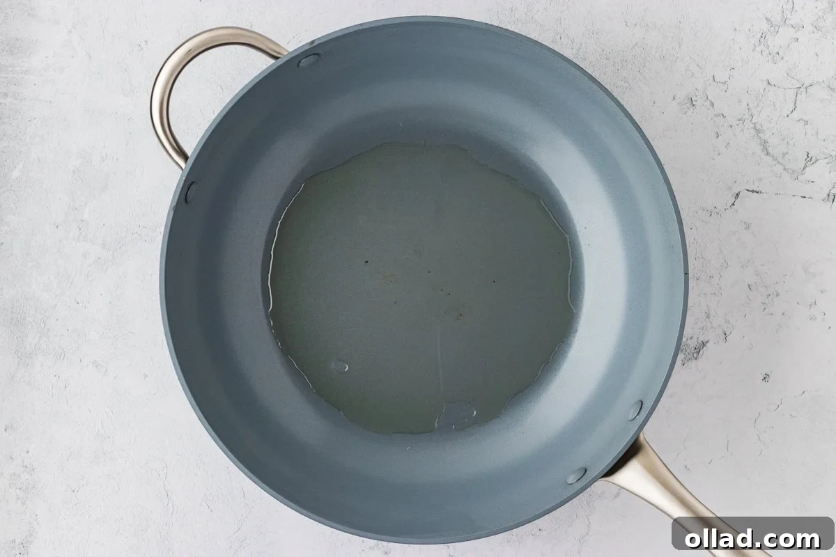 Irresistible Gluten-Free Sweet and Sour Chicken 14 overhead view of frying pan with cooking oil