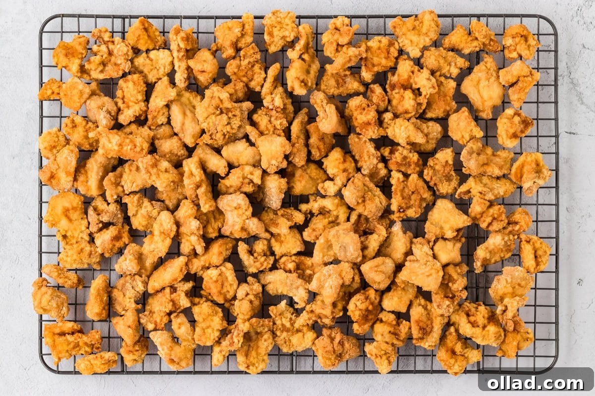Irresistible Gluten-Free Sweet and Sour Chicken 15 cooked coated chicken on drying rack