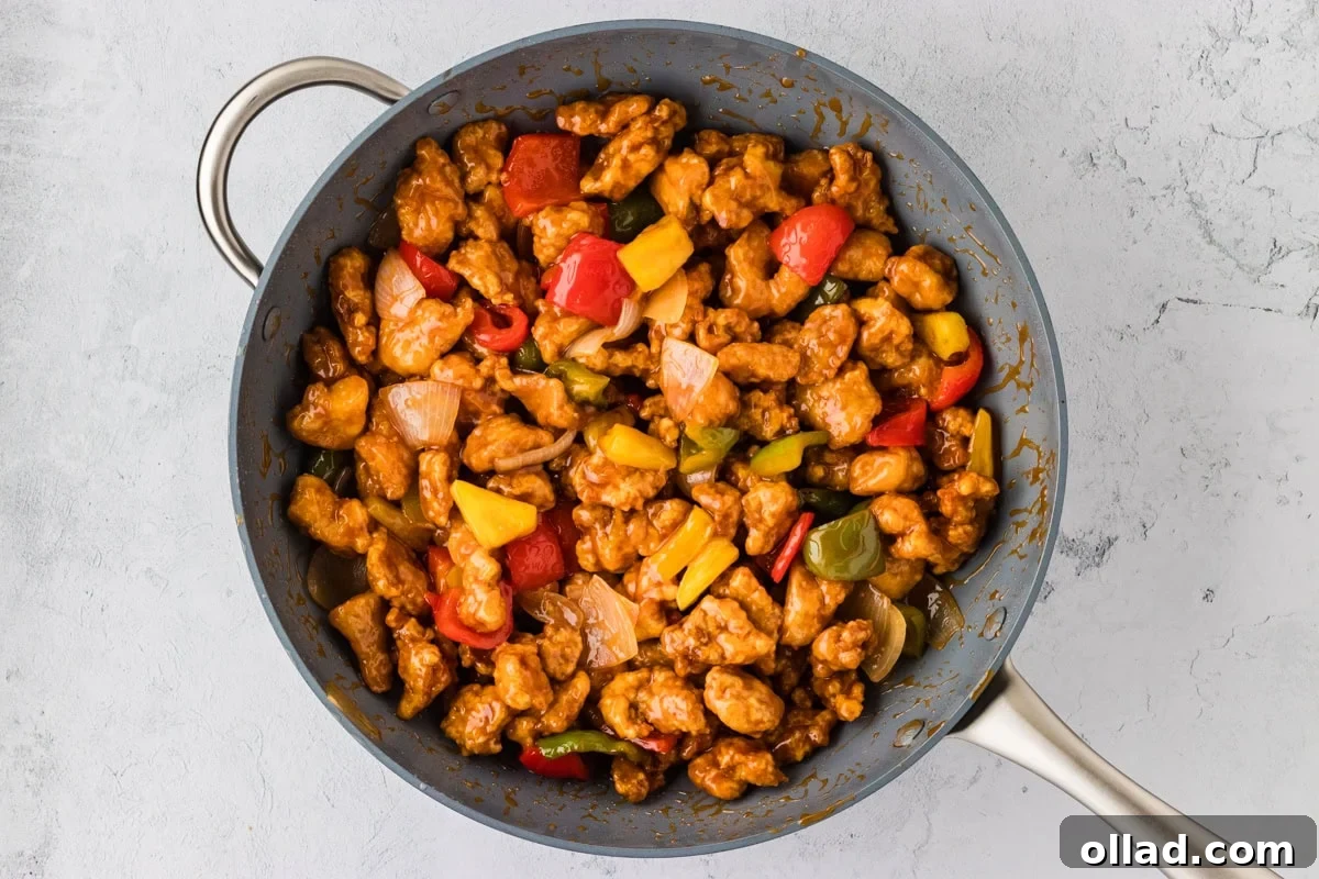 Irresistible Gluten-Free Sweet and Sour Chicken 18 sweet and sour chicken in wok with stir fry vegetables