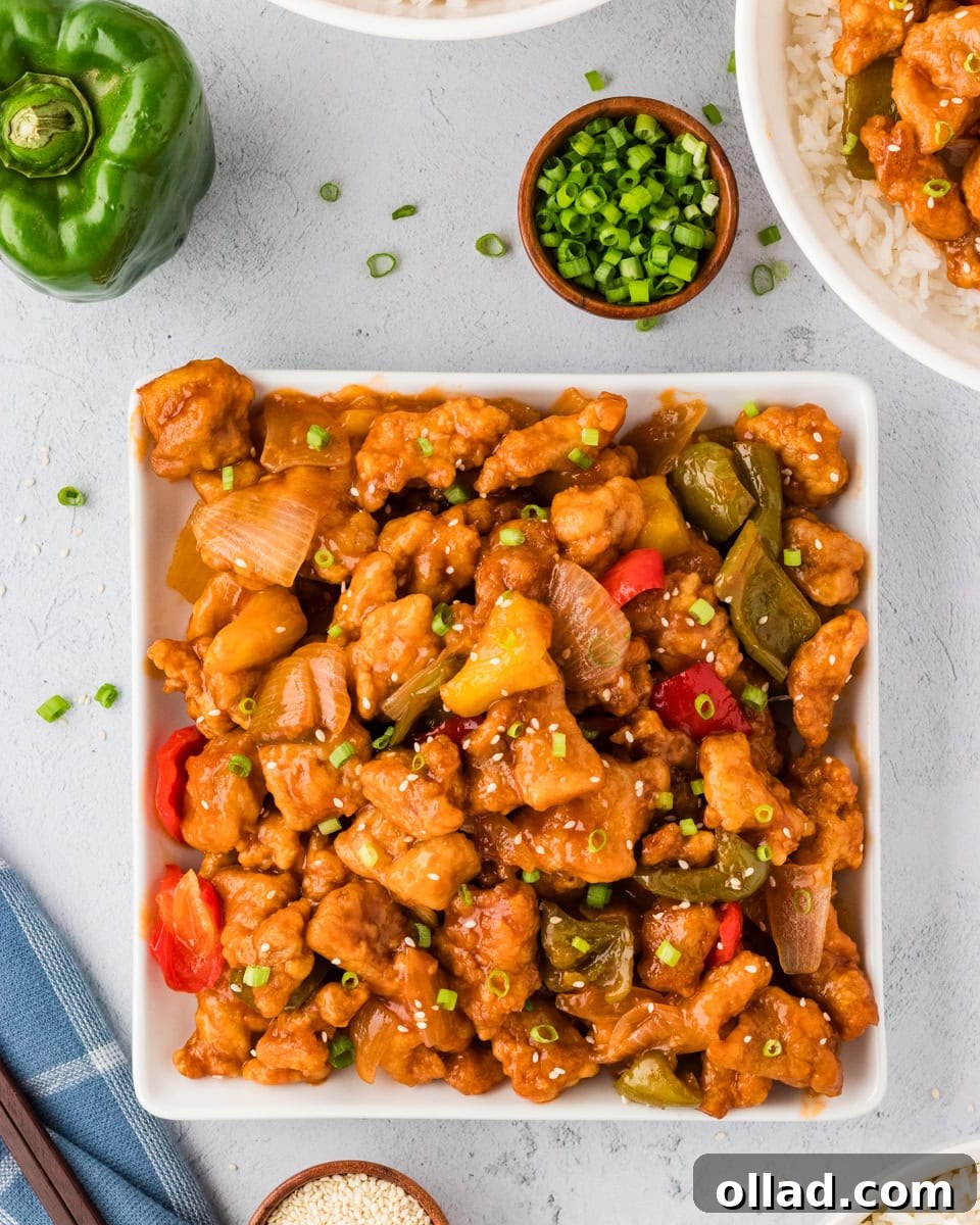 Irresistible Gluten-Free Sweet and Sour Chicken 4 overhead view of sweet and sour chicken with veggies in square white bowl