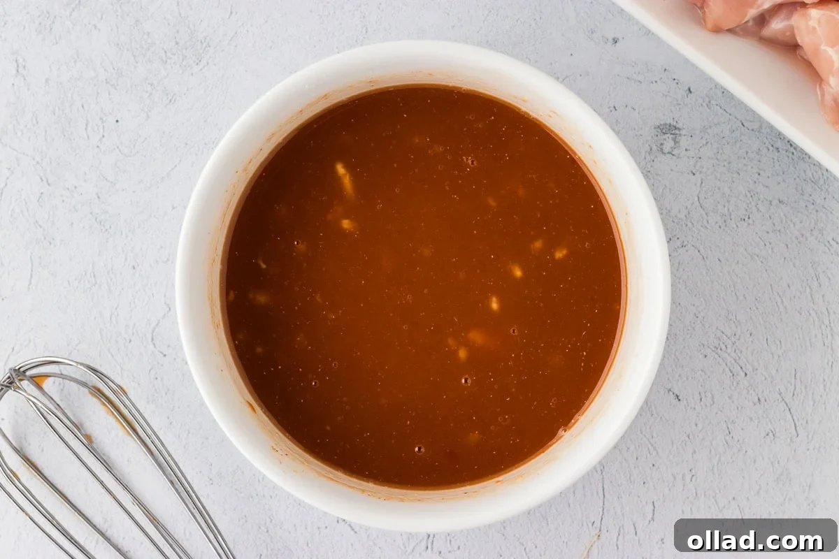 Irresistible Gluten-Free Sweet and Sour Chicken 8 ketchup, pineapple, vinegar mixture in white bowl