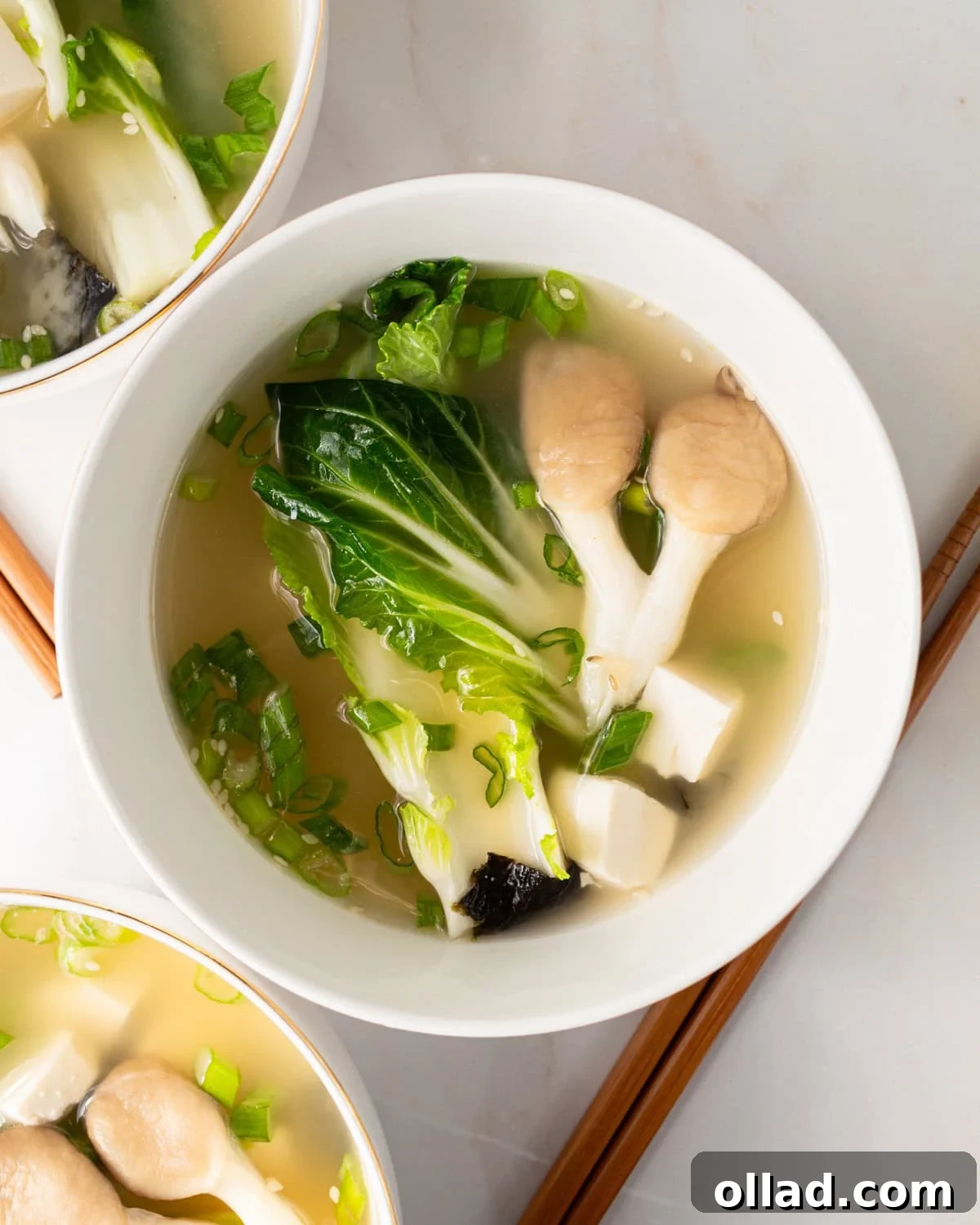 Savory Gluten-Free Miso Bowl 2 gluten-free miso soup in a white bowl with bok choy and mushrooms and chopsticks next to the bowl