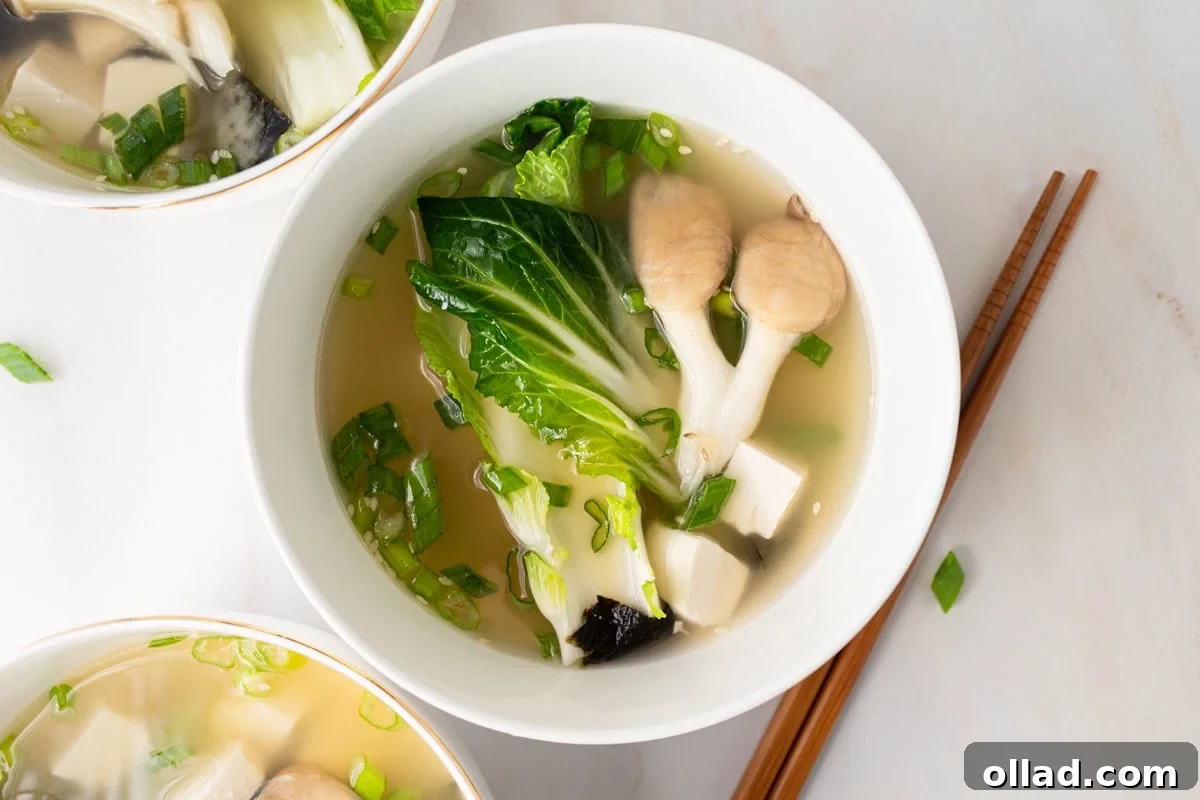 Savory Gluten-Free Miso Bowl 12 horizontal shot of gluten-free miso soup in white bowl with chopsticks next to it