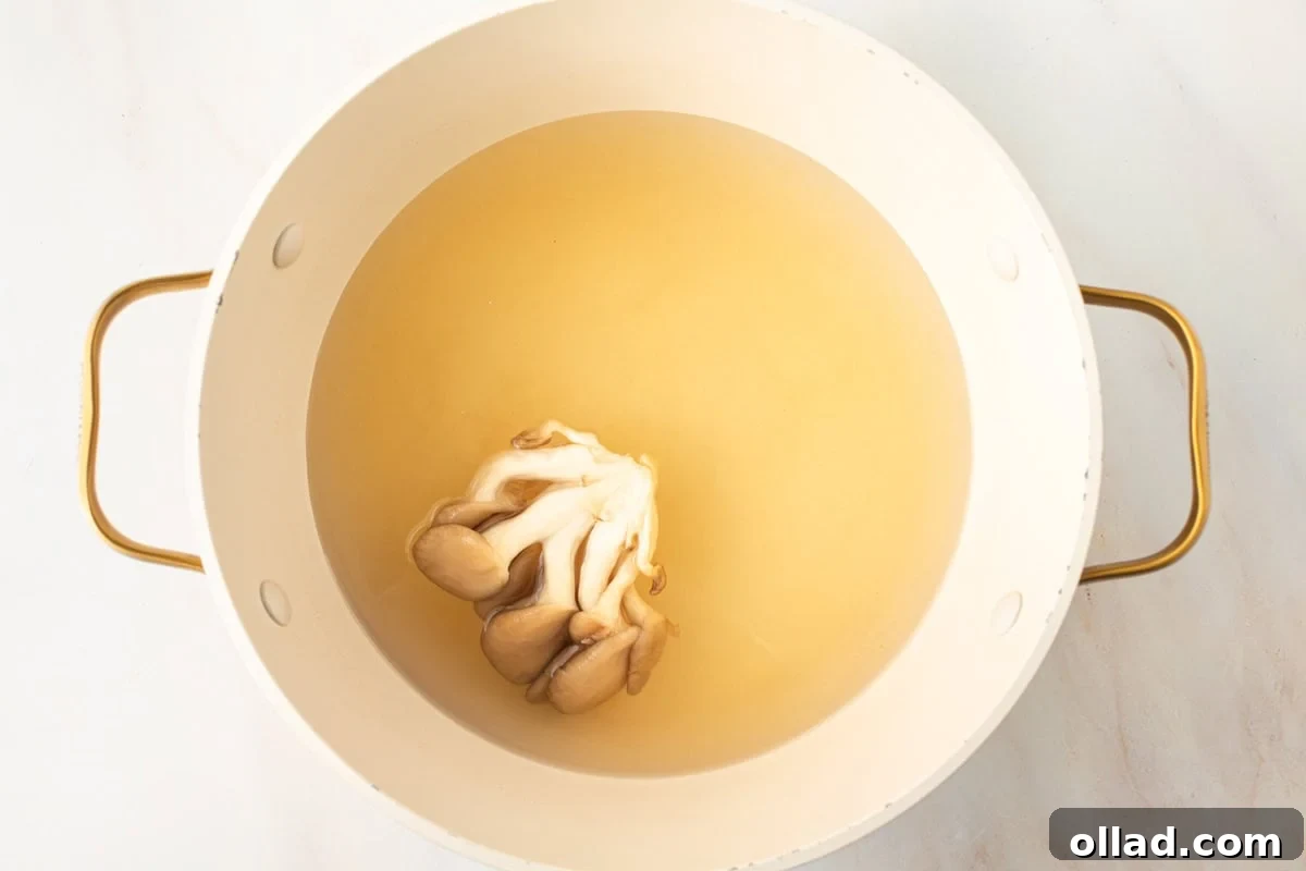 Savory Gluten-Free Miso Bowl 8 oyster mushrooms cooking in gluten-free miso soup broth