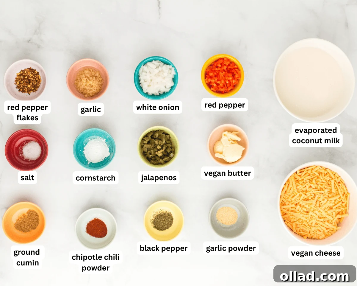 An overhead view of carefully measured and prepped vegan queso ingredients laid out on a clean countertop, ready for cooking.
