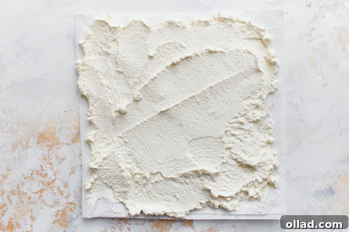 ricotta cheese spread on a paper towel