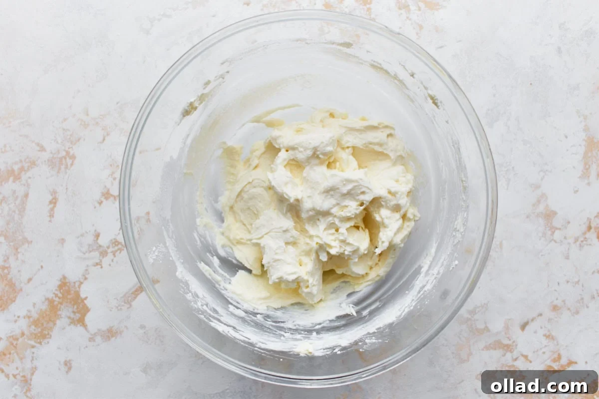 cannoli filling mixture in a glass bowl on a light surface