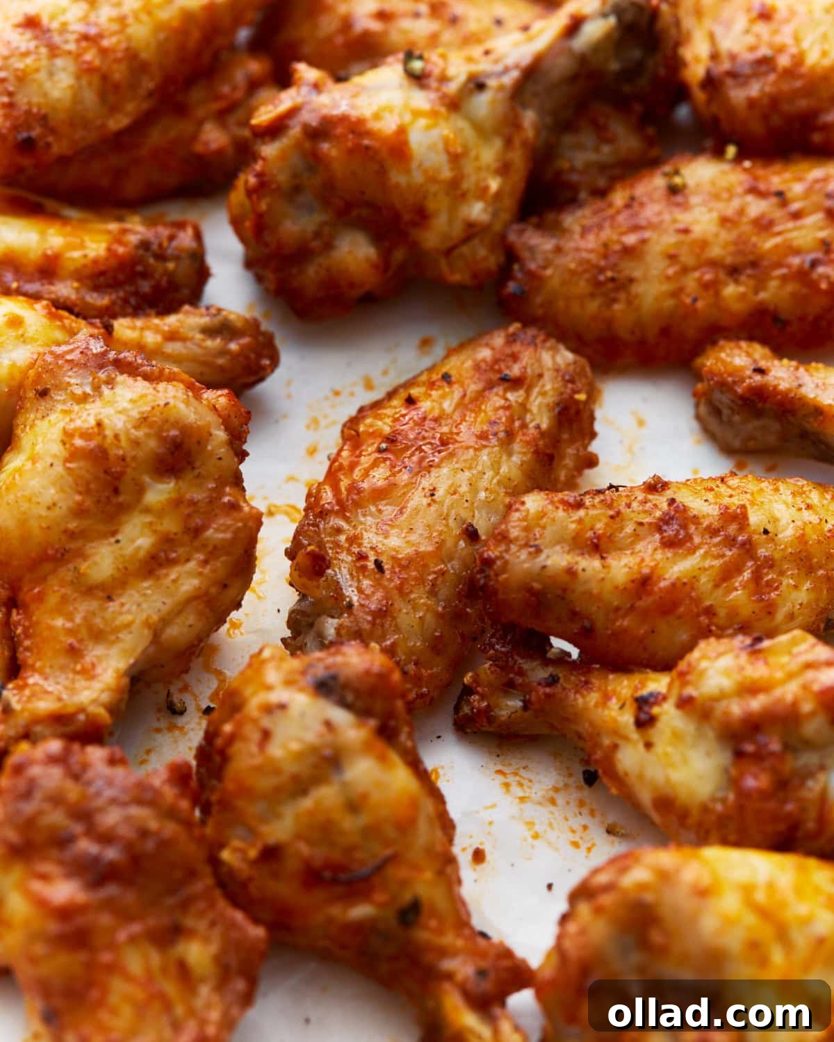 a bunch of crispy gluten-free chicken wings coated in homemade buffalo sauce and seasonings