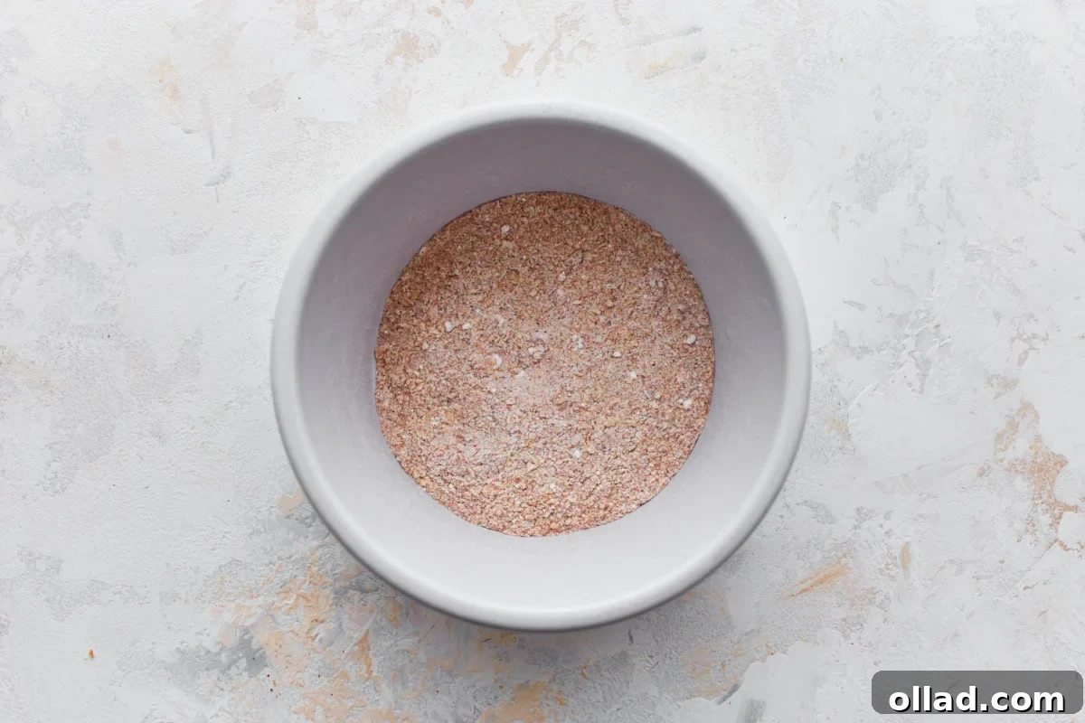 gluten-free chicken wing spice rub in a white bowl on a light surface